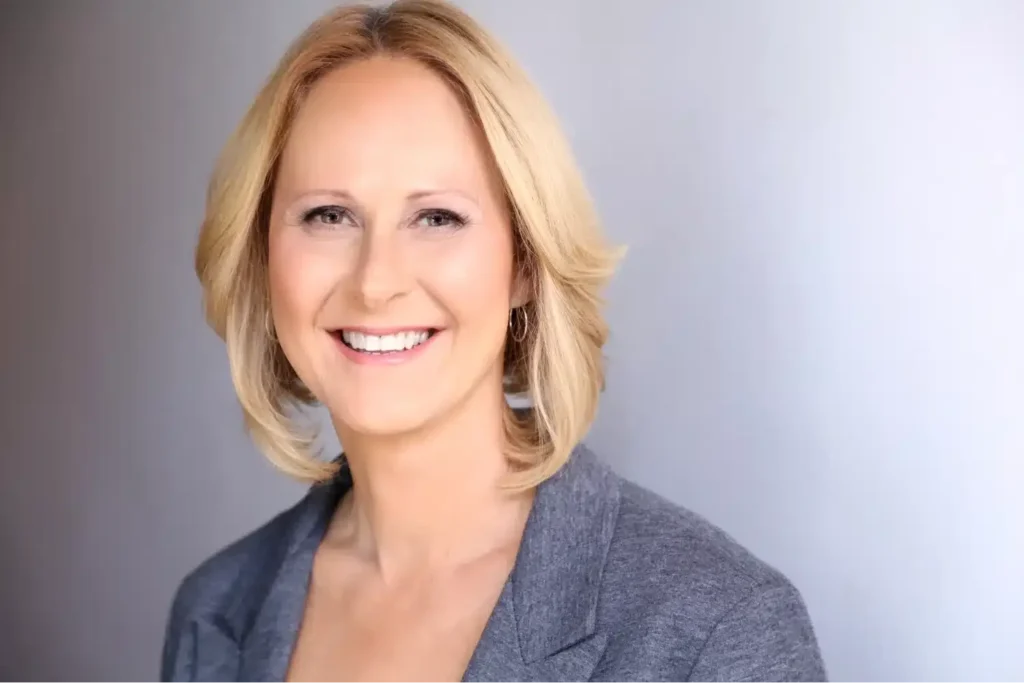 Close-up of a smiling blonde business professional for her official female headshot